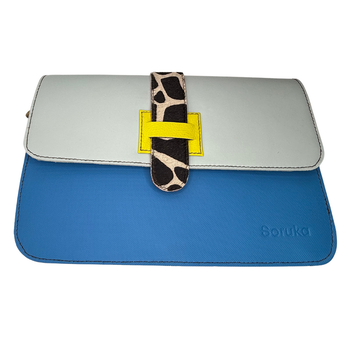 Recycled leather crossbody with reversible flap (solid/animal print), adjustable strap, 3 compartments—chic & eco-smart for women 30+.