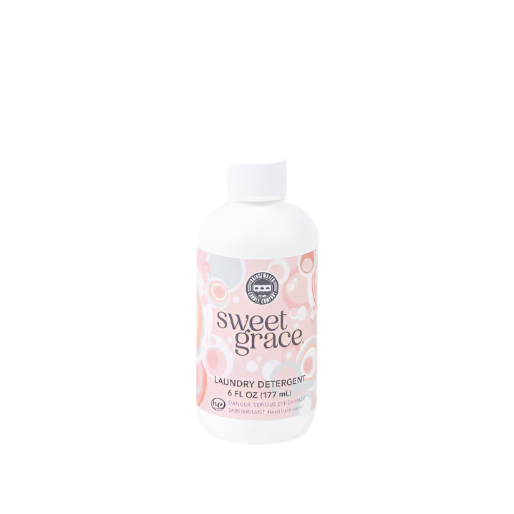 "Sweet Grace Laundry Detergent 6 oz – fabric-safe sanitizing formula with long-lasting oriental & spice scent of passion fruit, sparkling tea, and patchouli."