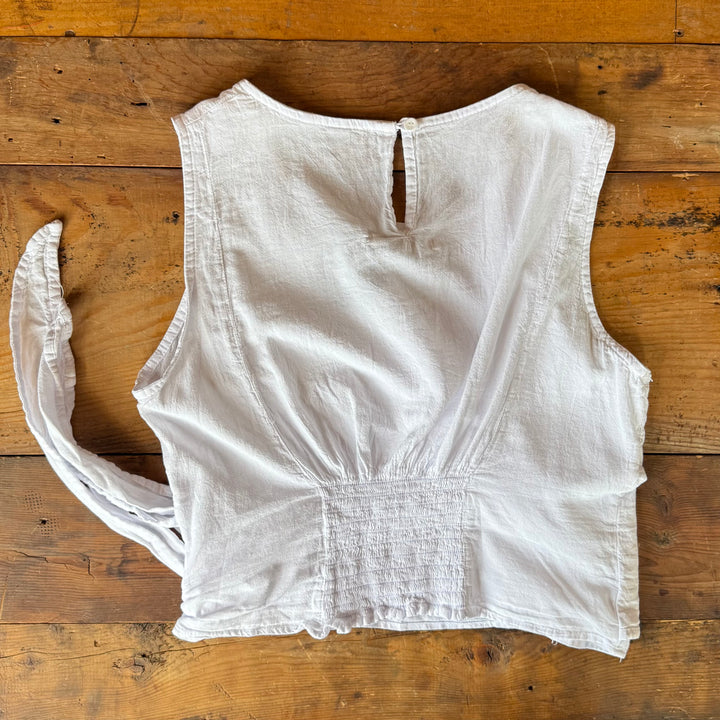 "Women’s sleeveless top – features front tie detail, cinched back, and true-to-size fit for a flattering and feminine look."