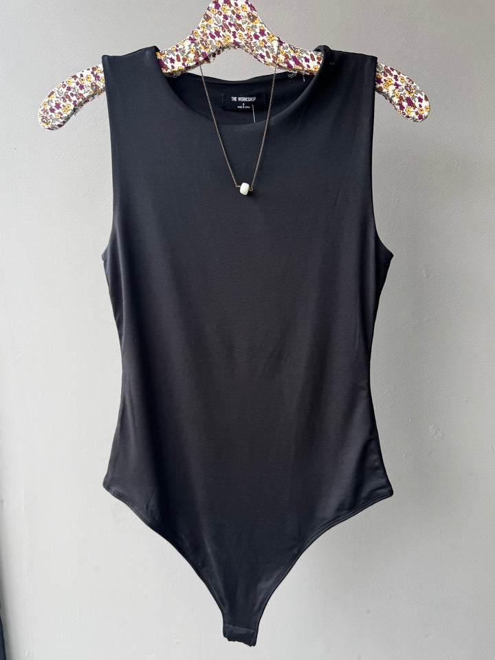 Soft, stretchy top with a flattering fit—perfect for layering and empowering stylish women 30+.