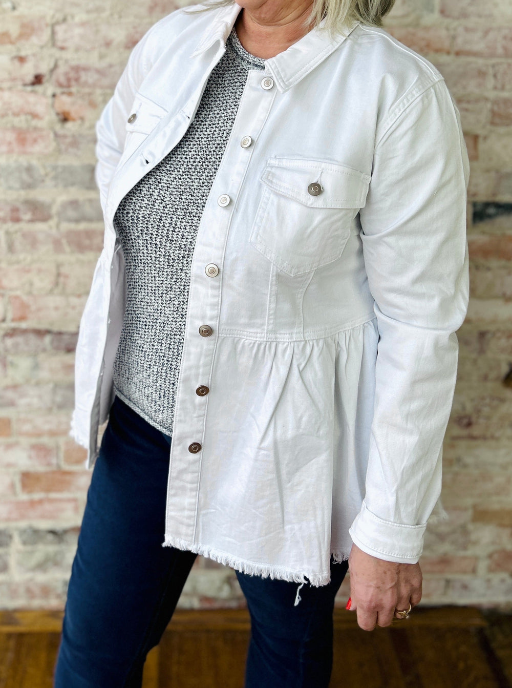 "Women's white peplum denim jacket – flirty and casual style with a fitted silhouette; may run snug in the bust, consider sizing up"