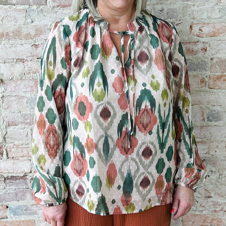 "Women's lightweight romantic top with relaxed fit – versatile for any occasion, available in plus sizes; runs slightly small in fit"