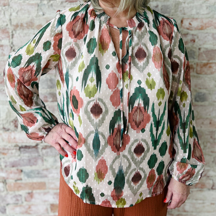 "Women's lightweight romantic top with relaxed fit – versatile for any occasion, available in plus sizes; runs slightly small in fit"