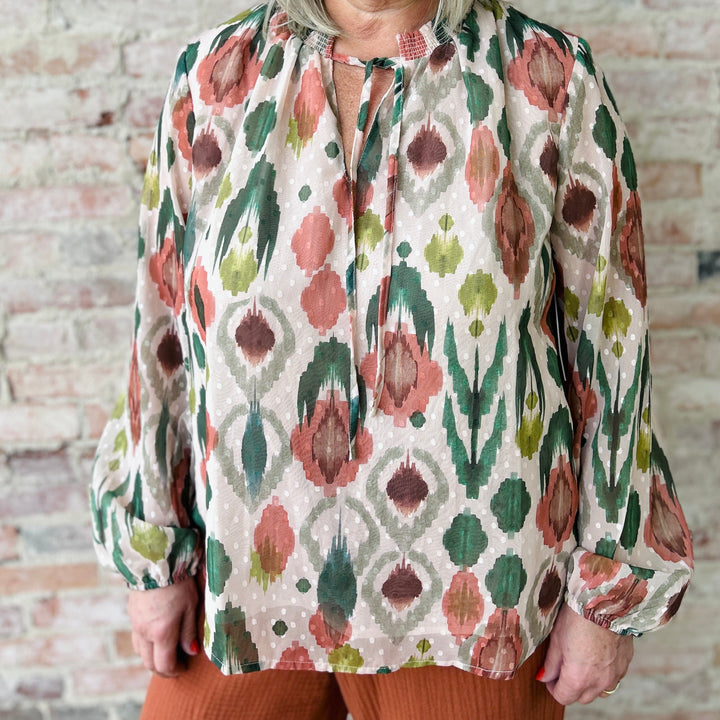 "Women's lightweight romantic top with relaxed fit – versatile for any occasion, available in plus sizes; runs slightly small in fit"