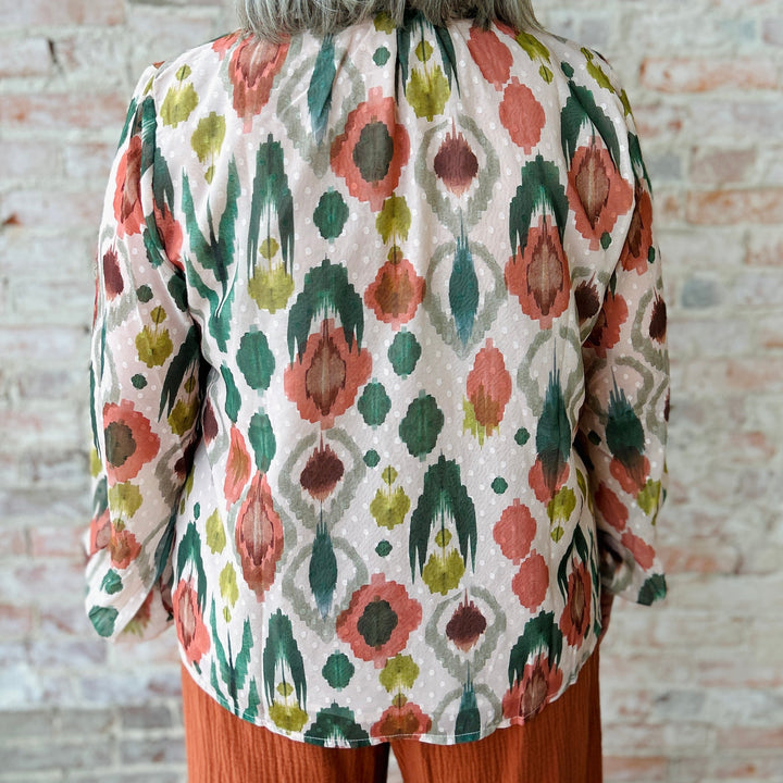 "Women's lightweight romantic top with relaxed fit – versatile for any occasion, available in plus sizes; runs slightly small in fit"