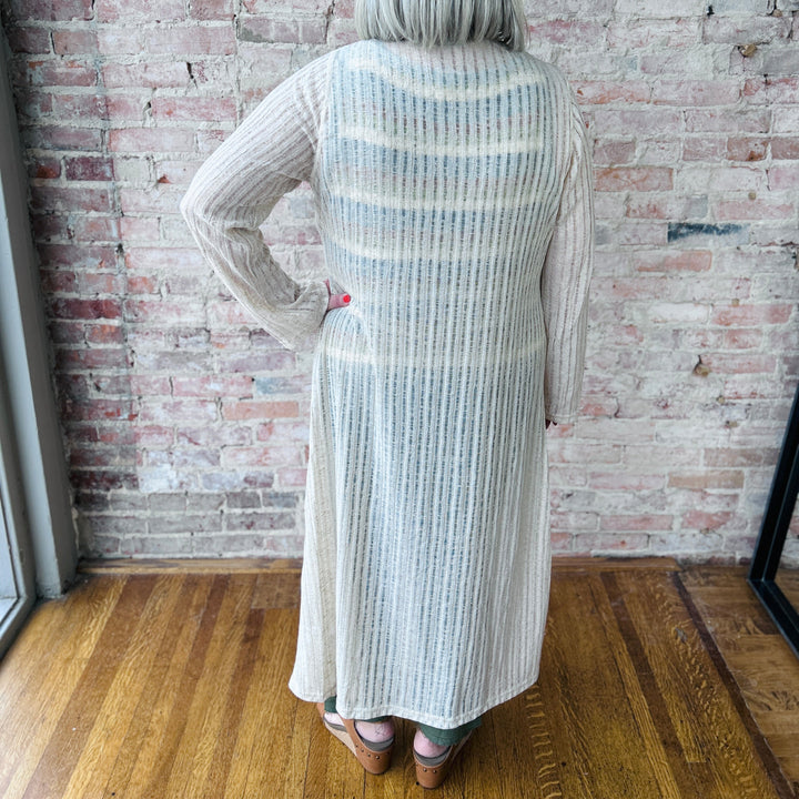 "Women's Needle Out lightweight maxi duster – long, flowy design adds effortless sophistication to any outfit, perfect for layering"