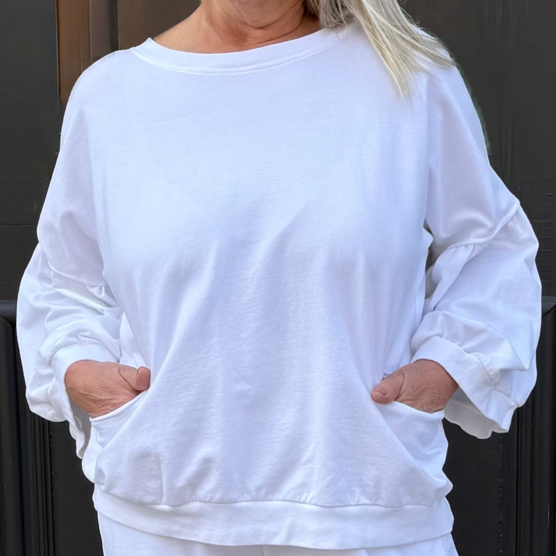 Fresh, vibrant top that's lightweight and breathable—runs slightly big for all-day comfort on confident women 30+.
