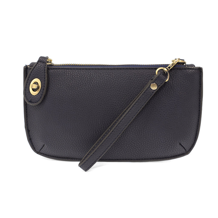 Chic convertible wristlet with zip and turn-lock closure, card slots, and straps—stylish, functional gift for confident women 30+.