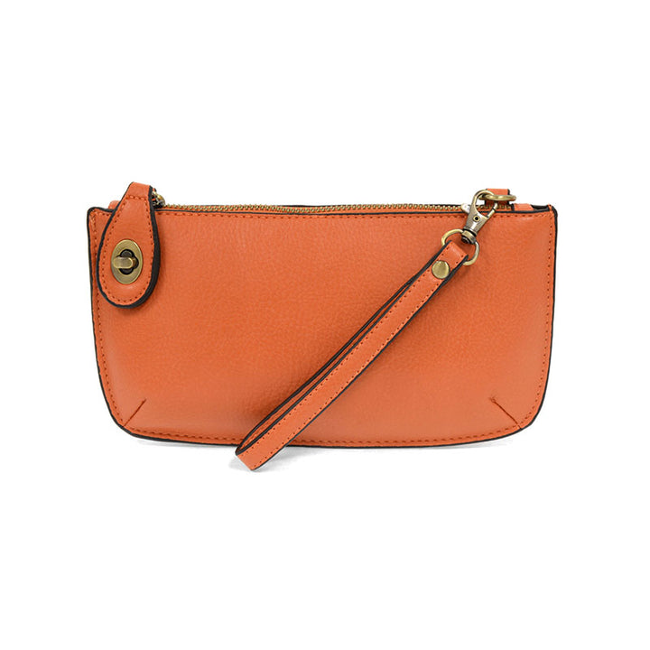 Chic convertible wristlet with zip and turn-lock closure, card slots, and straps—stylish, functional gift for confident women 30+.