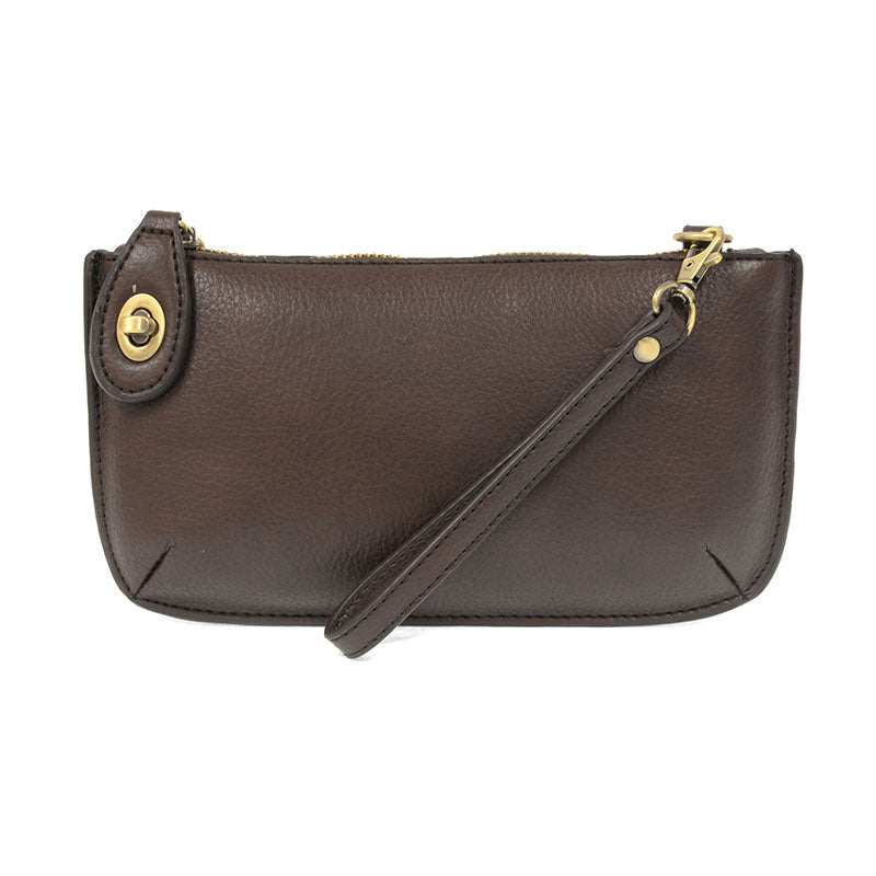 Chic convertible wristlet with zip and turn-lock closure, card slots, and straps—stylish, functional gift for confident women 30+.