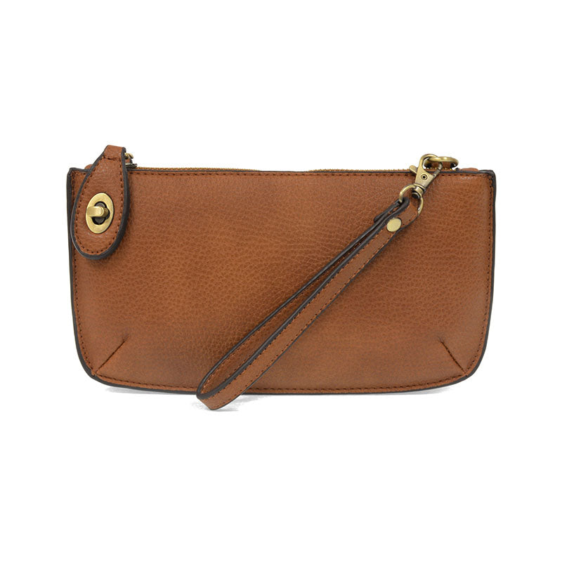 Chic convertible wristlet with zip and turn-lock closure, card slots, and straps—stylish, functional gift for confident women 30+.