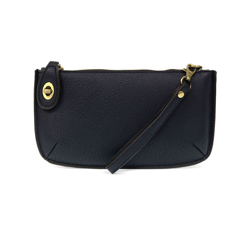 Chic convertible wristlet with zip and turn-lock closure, card slots, and straps—stylish, functional gift for confident women 30+.
