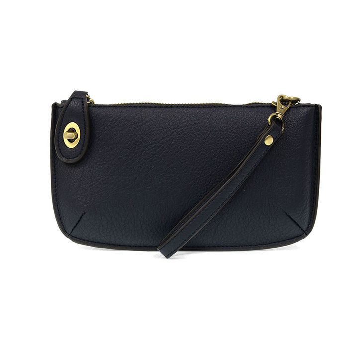 Chic convertible wristlet with zip and turn-lock closure, card slots, and straps—stylish, functional gift for confident women 30+.
