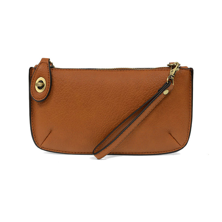 Chic convertible wristlet with zip and turn-lock closure, card slots, and straps—stylish, functional gift for confident women 30+.