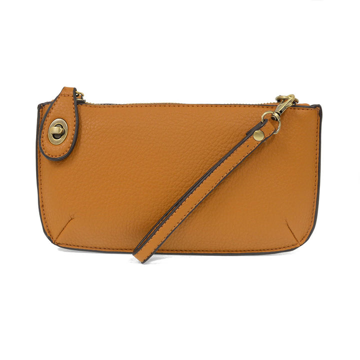 Chic convertible wristlet with zip and turn-lock closure, card slots, and straps—stylish, functional gift for confident women 30+.