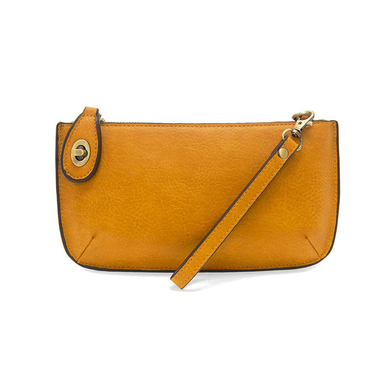 Chic convertible wristlet with zip and turn-lock closure, card slots, and straps—stylish, functional gift for confident women 30+.