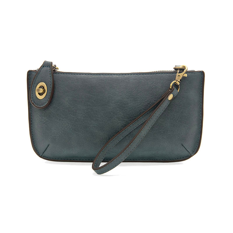 Chic convertible wristlet with zip and turn-lock closure, card slots, and straps—stylish, functional gift for confident women 30+.