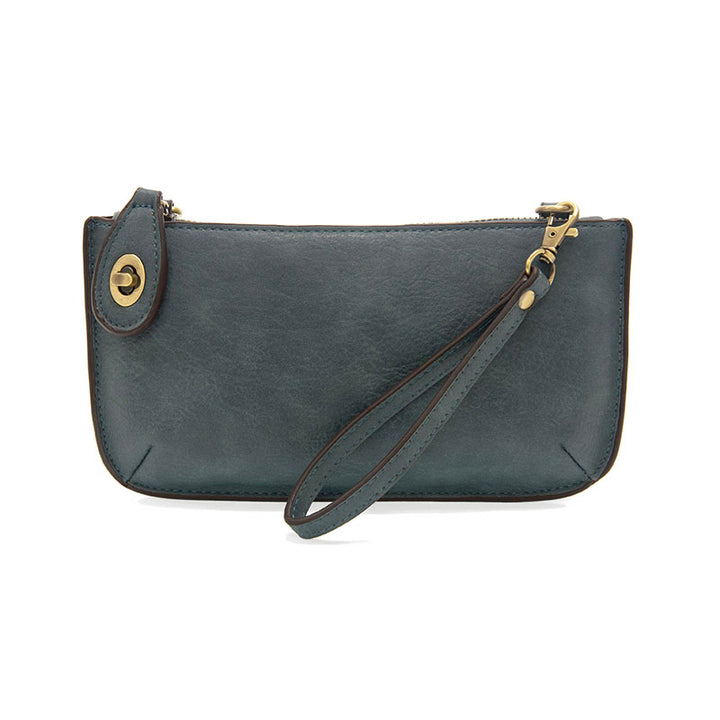 Chic convertible wristlet with zip and turn-lock closure, card slots, and straps—stylish, functional gift for confident women 30+.