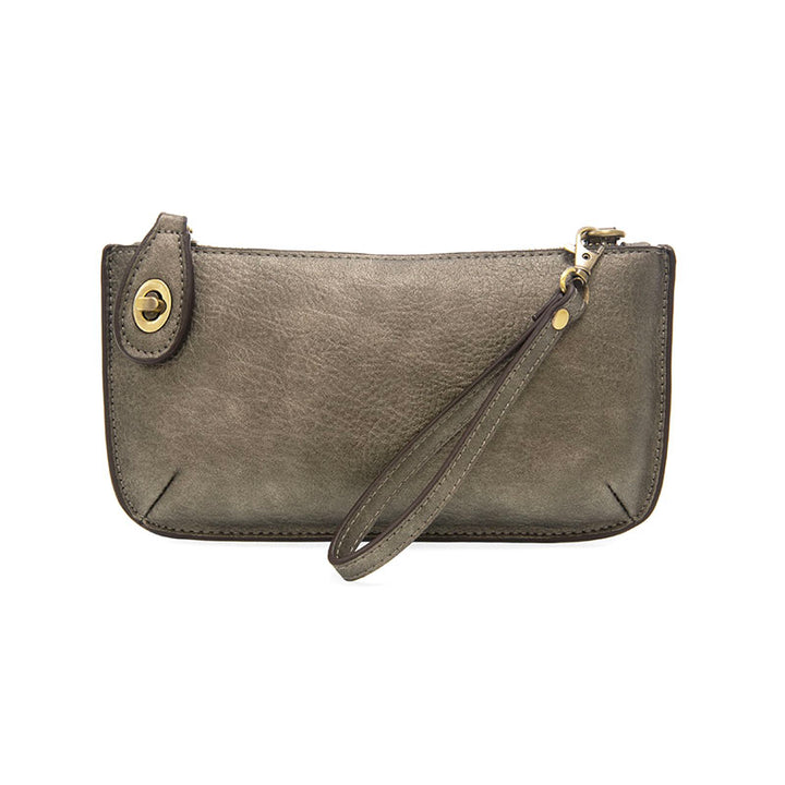 Chic convertible wristlet with zip and turn-lock closure, card slots, and straps—stylish, functional gift for confident women 30+.