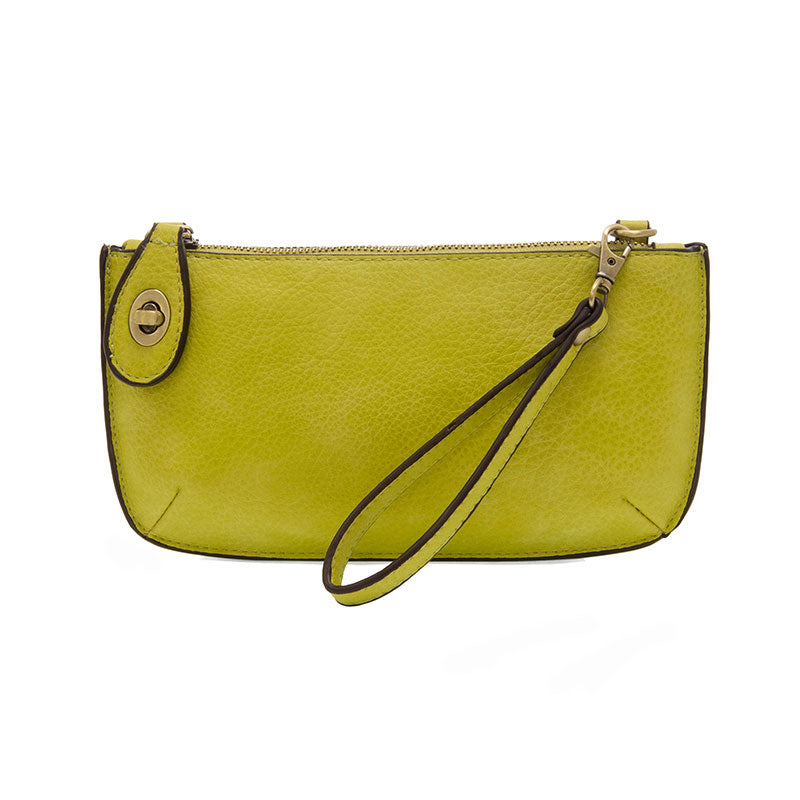 Chic convertible wristlet with zip and turn-lock closure, card slots, and straps—stylish, functional gift for confident women 30+.