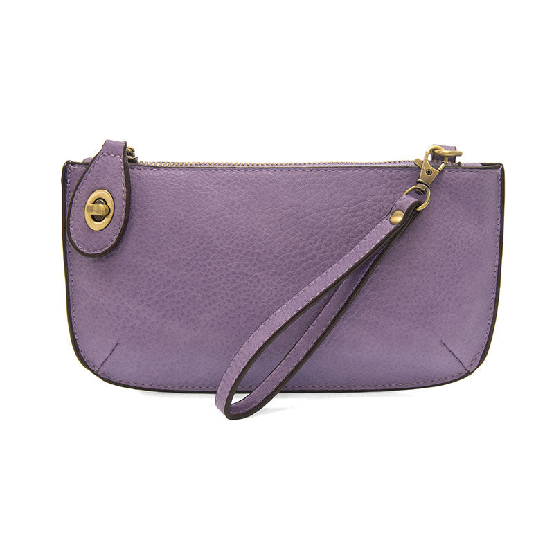 Chic convertible wristlet with zip and turn-lock closure, card slots, and straps—stylish, functional gift for confident women 30+.