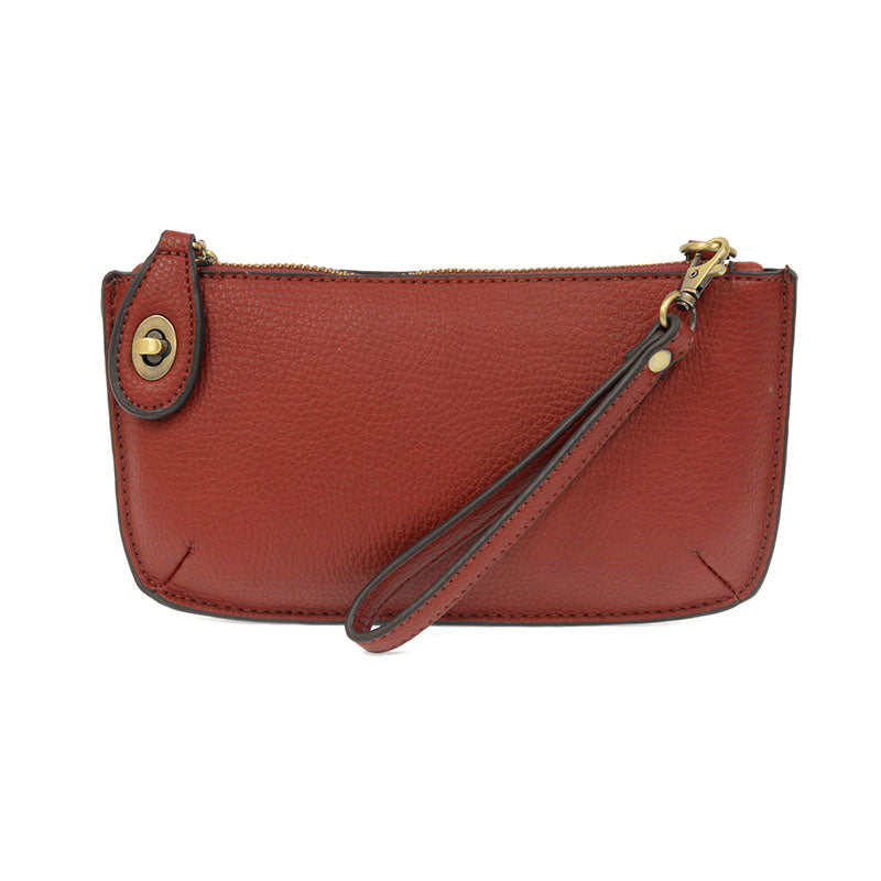 Chic convertible wristlet with zip and turn-lock closure, card slots, and straps—stylish, functional gift for confident women 30+.