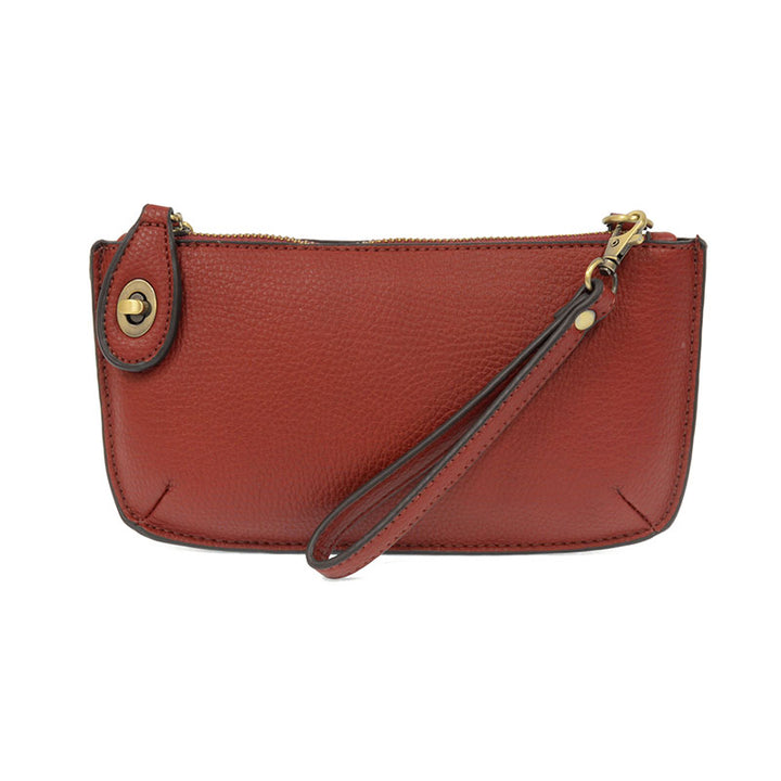 Chic convertible wristlet with zip and turn-lock closure, card slots, and straps—stylish, functional gift for confident women 30+.