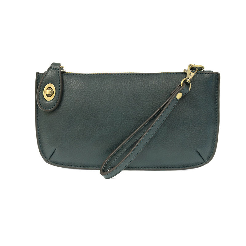 Chic convertible wristlet with zip and turn-lock closure, card slots, and straps—stylish, functional gift for confident women 30+.
