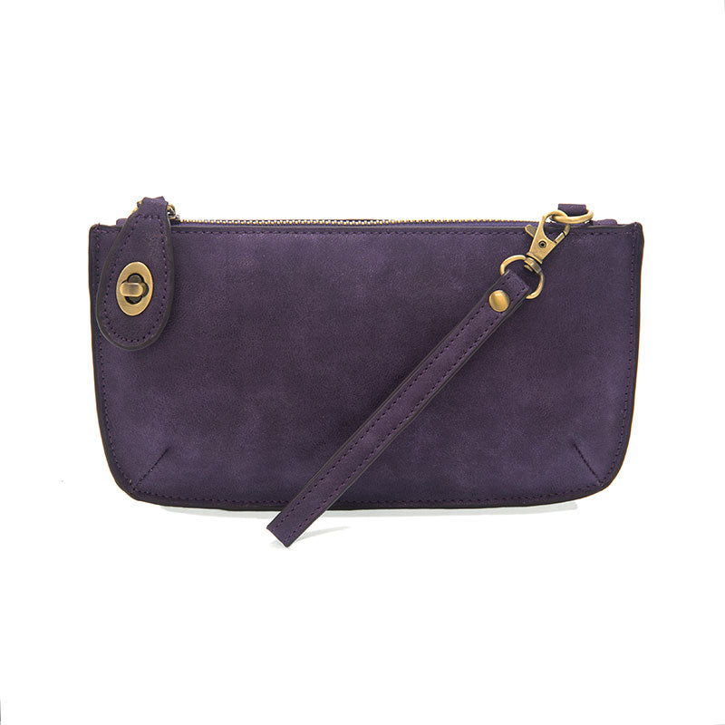 Chic convertible wristlet with zip and turn-lock closure, card slots, and straps—stylish, functional gift for confident women 30+.