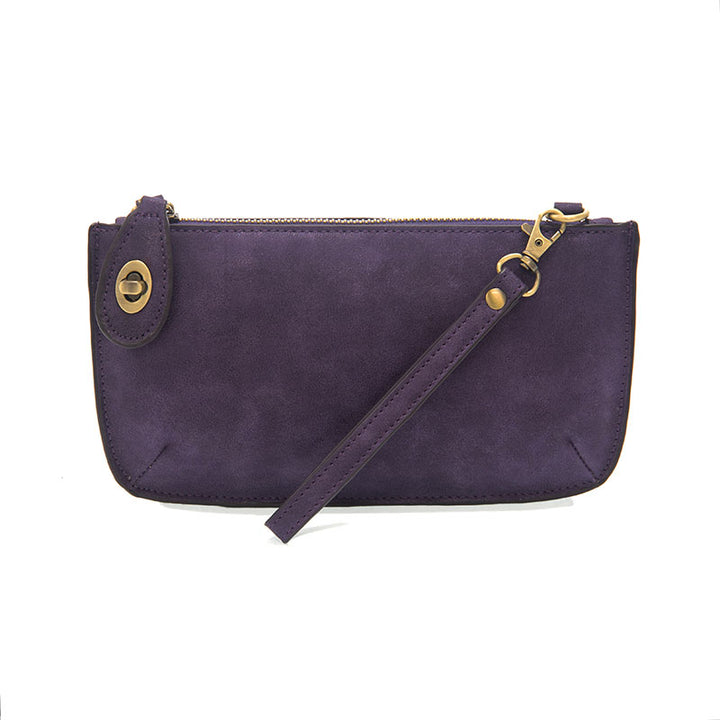 Chic convertible wristlet with zip and turn-lock closure, card slots, and straps—stylish, functional gift for confident women 30+.