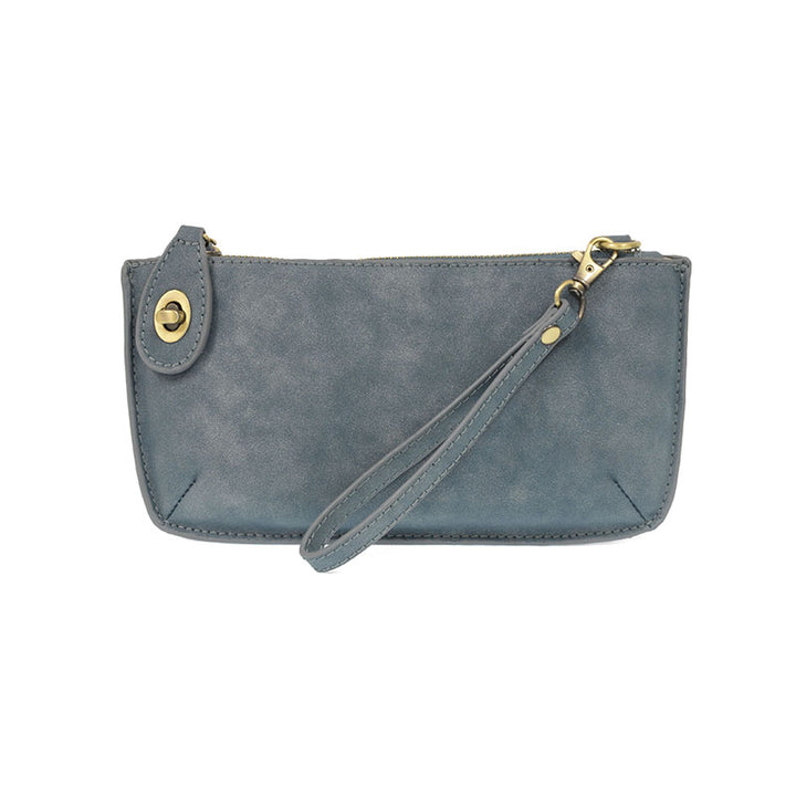 Chic convertible wristlet with zip and turn-lock closure, card slots, and straps—stylish, functional gift for confident women 30+.