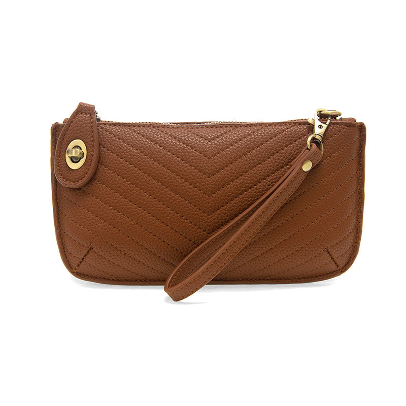 Chic convertible wristlet with zip and turn-lock closure, card slots, and straps—stylish, functional gift for confident women 30+.