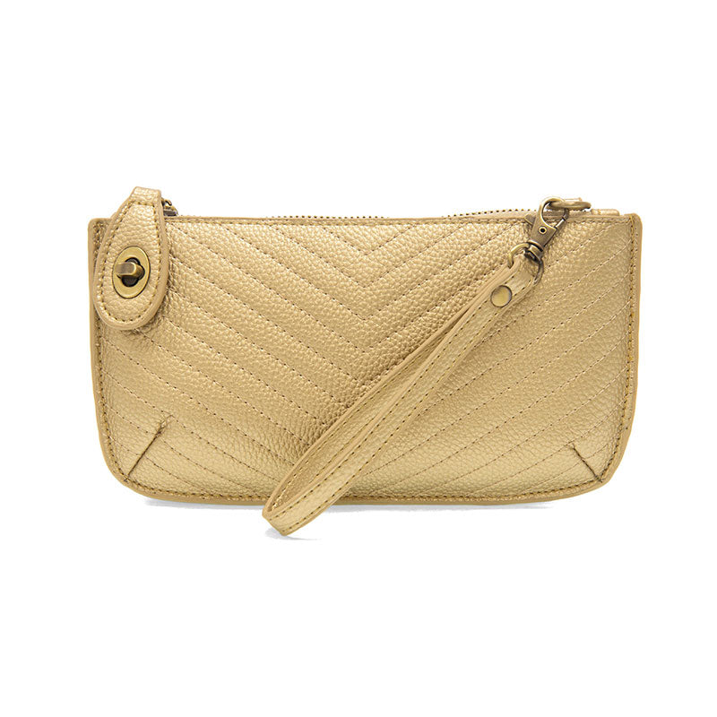 Chic convertible wristlet with zip and turn-lock closure, card slots, and straps—stylish, functional gift for confident women 30+.