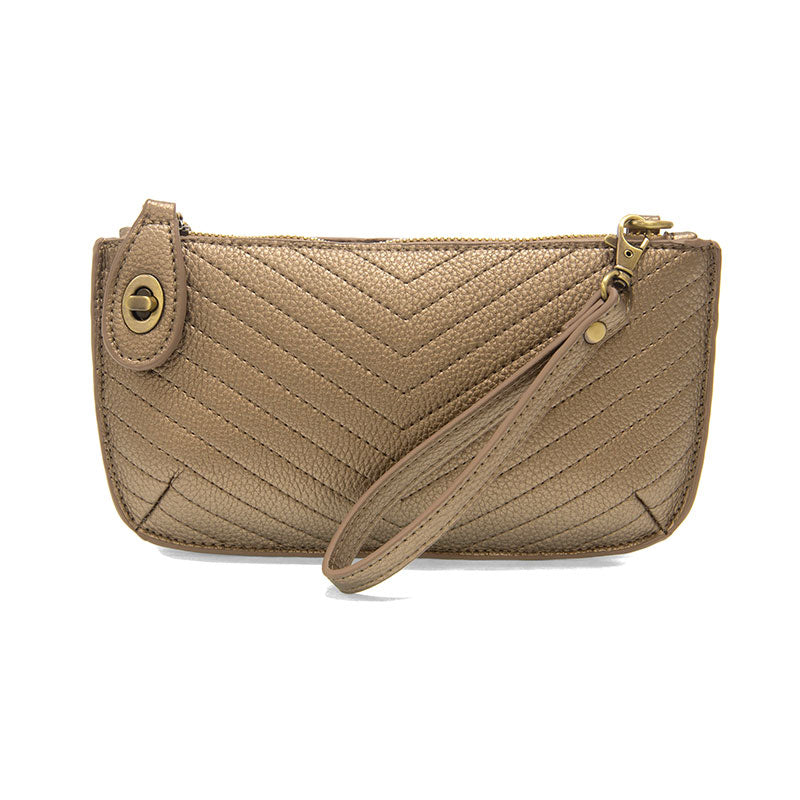 Chic convertible wristlet with zip and turn-lock closure, card slots, and straps—stylish, functional gift for confident women 30+.