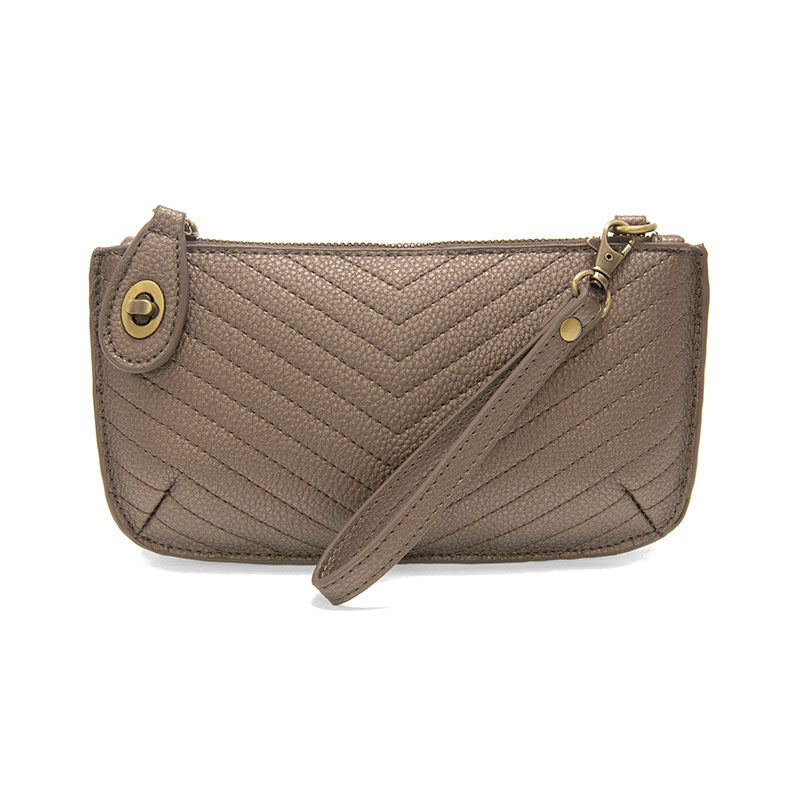 Chic convertible wristlet with zip and turn-lock closure, card slots, and straps—stylish, functional gift for confident women 30+.
