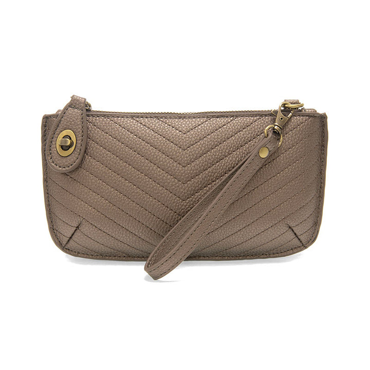 Chic convertible wristlet with zip and turn-lock closure, card slots, and straps—stylish, functional gift for confident women 30+.