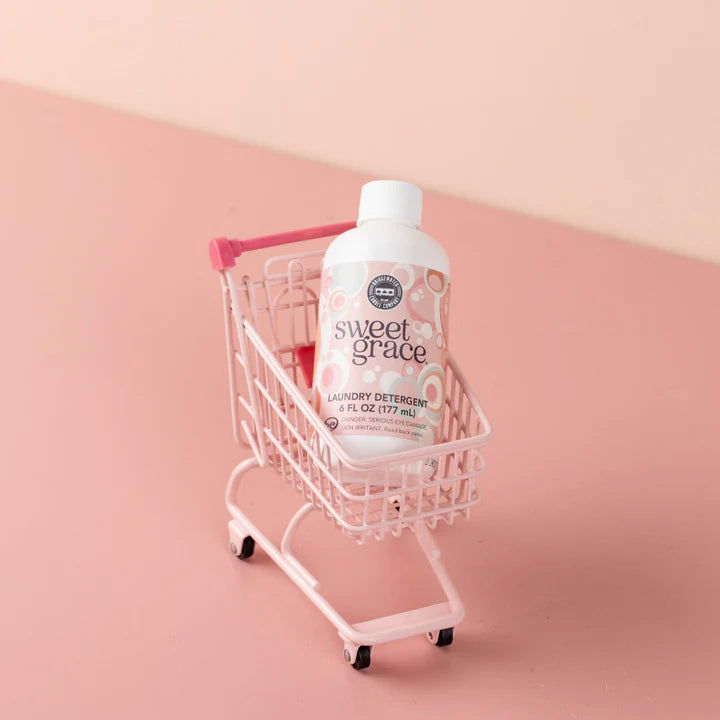 "Sweet Grace Laundry Detergent 6 oz – fabric-safe sanitizing formula with long-lasting oriental & spice scent of passion fruit, sparkling tea, and patchouli."