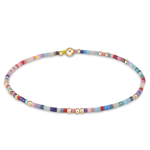 Colorful seed bead bracelet with 14k gold-filled accents, stretchy fit, and waterproof design—perfect for stacking and everyday wear.
