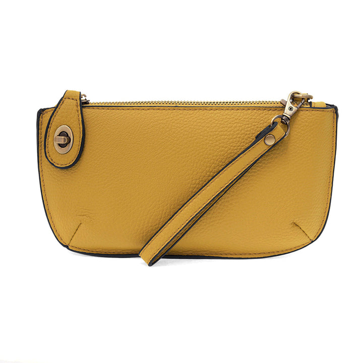 Chic convertible wristlet with zip and turn-lock closure, card slots, and straps—stylish, functional gift for confident women 30+.