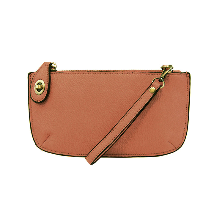 Chic convertible wristlet with zip and turn-lock closure, card slots, and straps—stylish, functional gift for confident women 30+.