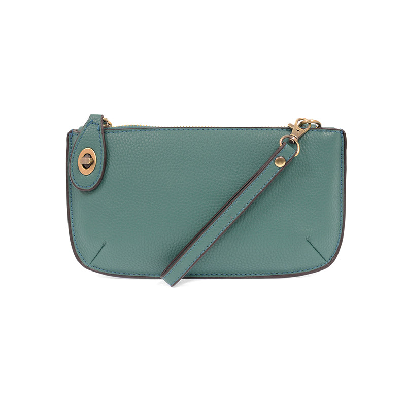 Chic convertible wristlet with zip and turn-lock closure, card slots, and straps—stylish, functional gift for confident women 30+.