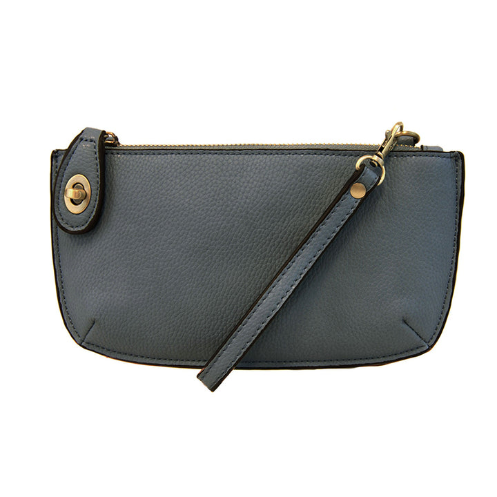 Chic convertible wristlet with zip and turn-lock closure, card slots, and straps—stylish, functional gift for confident women 30+.