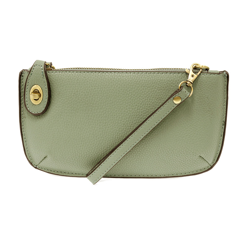 Chic convertible wristlet with zip and turn-lock closure, card slots, and straps—stylish, functional gift for confident women 30+.