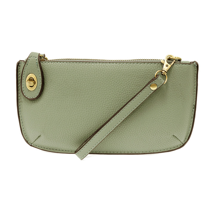 Chic convertible wristlet with zip and turn-lock closure, card slots, and straps—stylish, functional gift for confident women 30+.