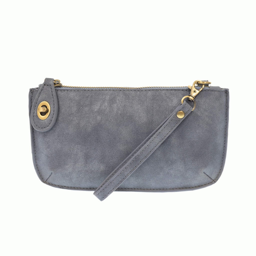Chic convertible wristlet with zip and turn-lock closure, card slots, and straps—stylish, functional gift for confident women 30+.