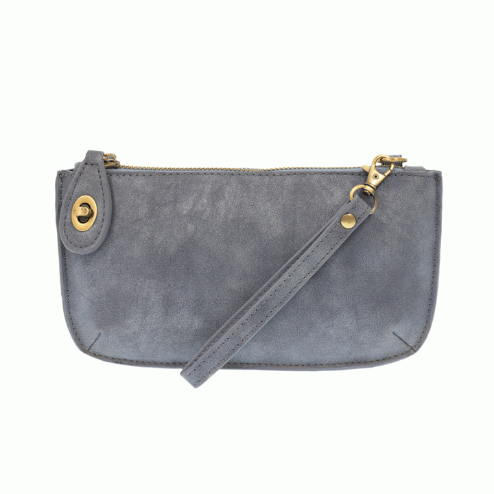 Chic convertible wristlet with zip and turn-lock closure, card slots, and straps—stylish, functional gift for confident women 30+.