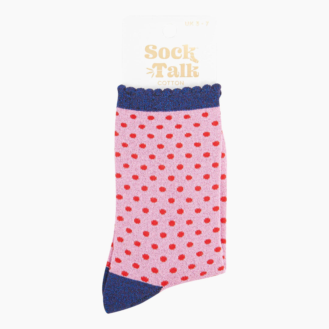 Pink cotton crew socks with red polka dots and navy blue glitter cuff and toe
