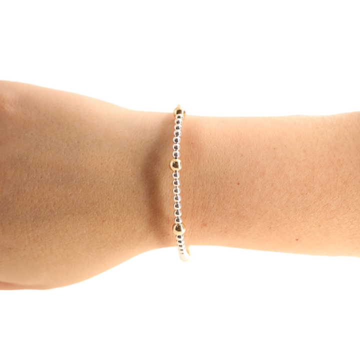 Beaded Blondes Olive Bracelet in silver and gold beads worn on a wrist
