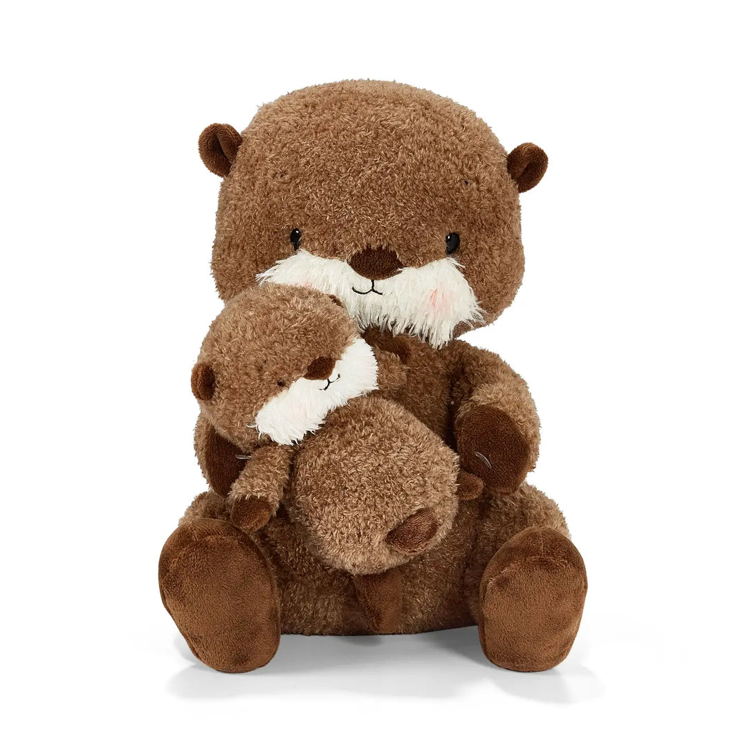 Brown plush otter parent holding baby otter stuffed animal with white chest fur