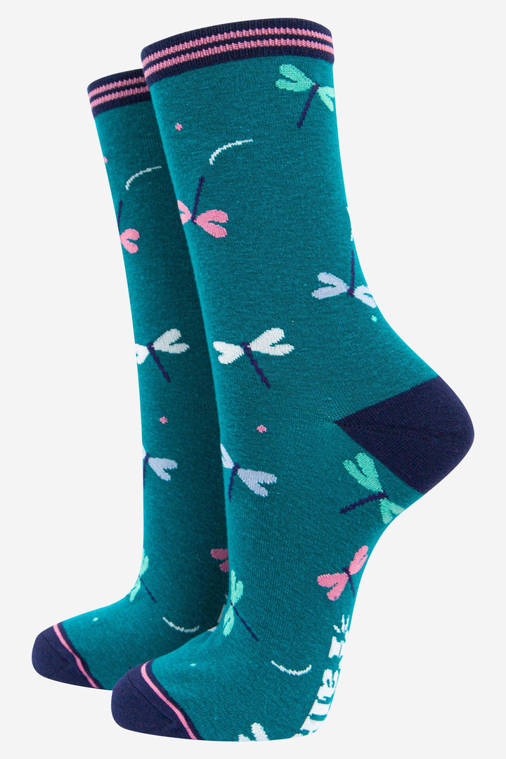 Teal bamboo crew socks with multicolor dragonfly print and navy striped cuff